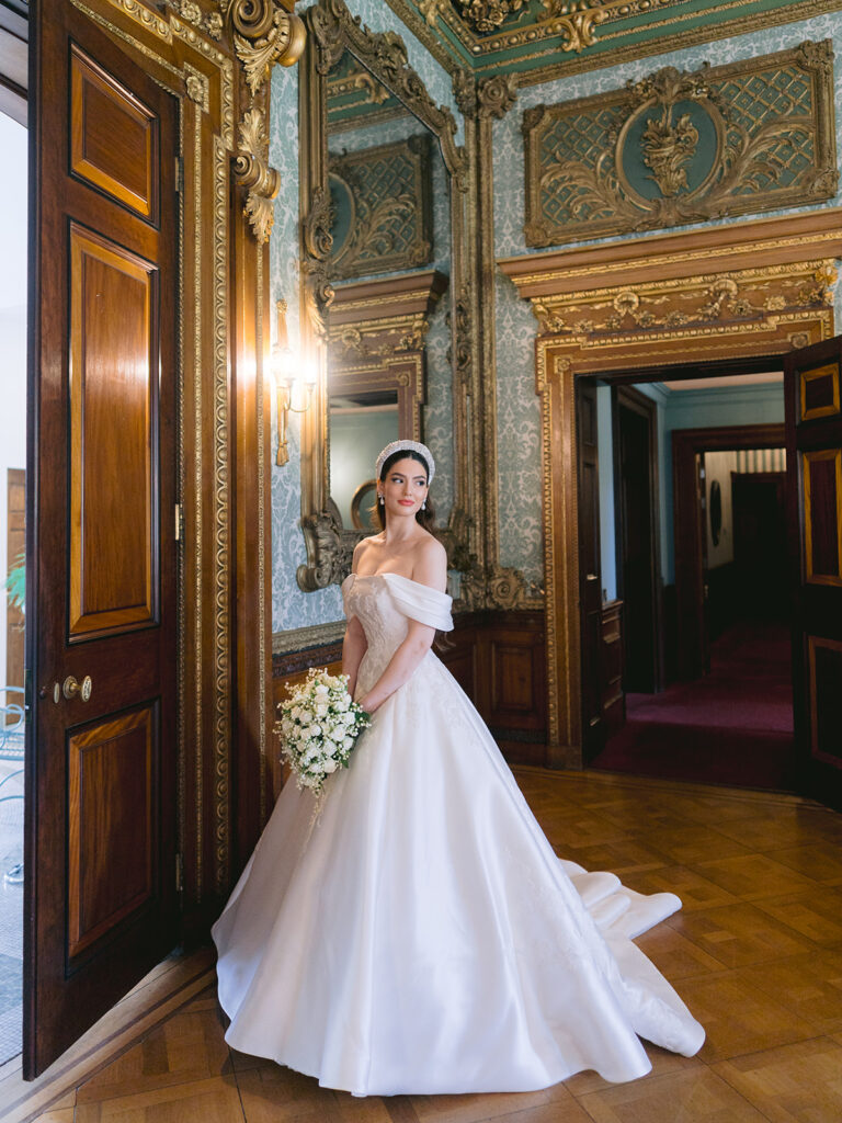 Elegant bride wearing couture gown being photographed